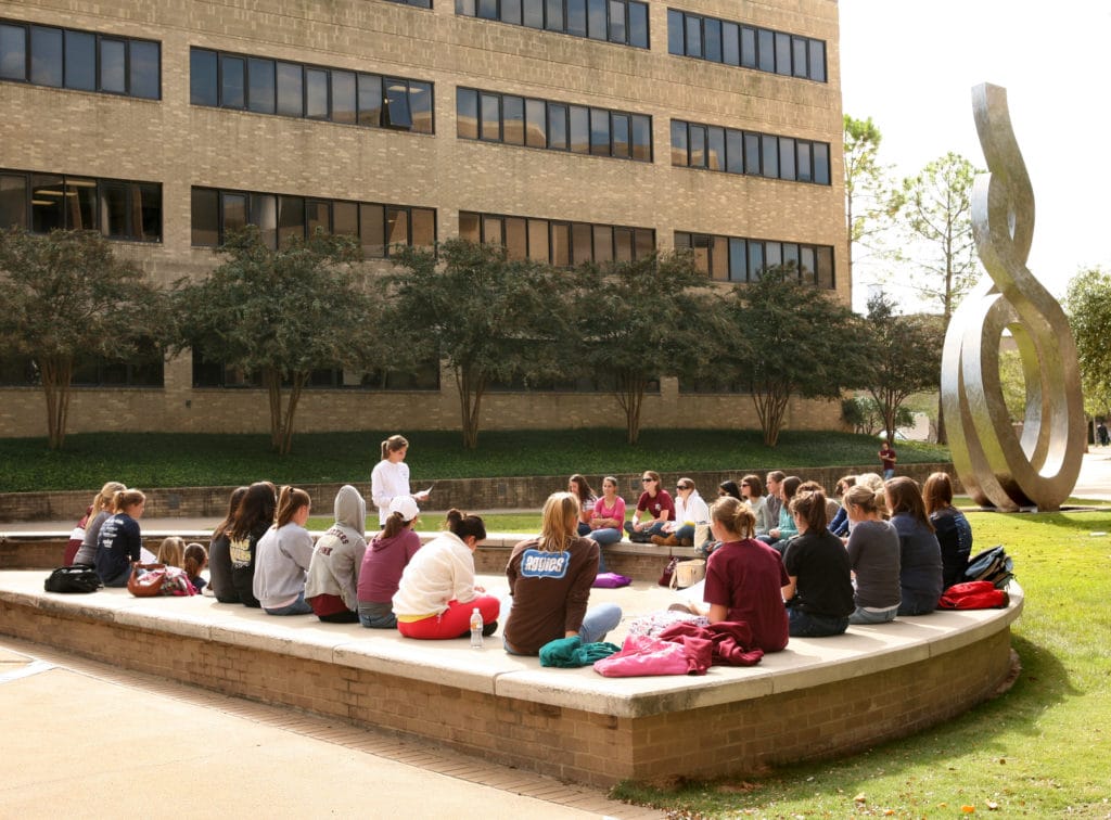 students attending class outdoors